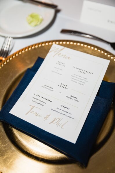 Elegant menu and place settings at backyard wedding reception by Scottsdale wedding photographer PMA Photography.