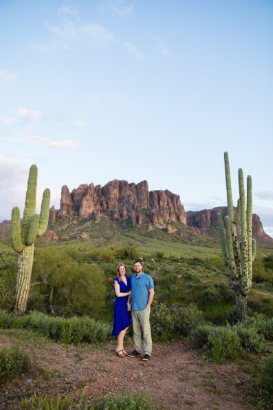 Couple pose during their Apache Junction engagement session by Arizona wedding photographer PMA Photography.