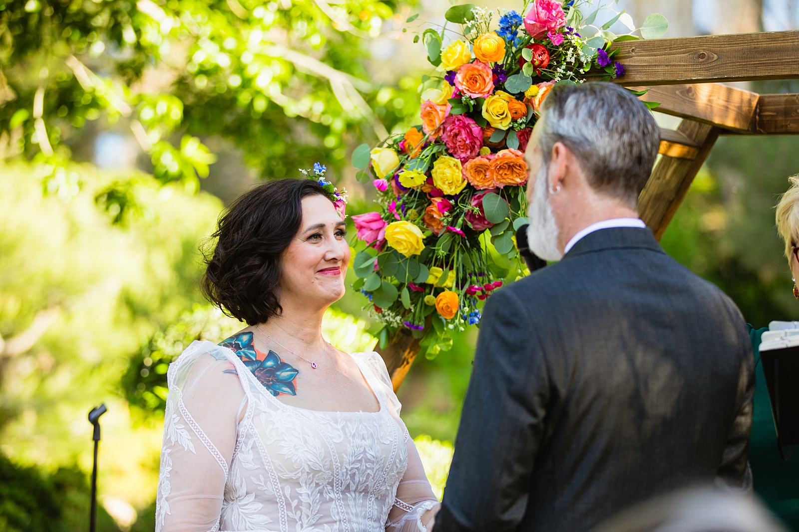 Bride looking at her groom during their wedding ceremony at Japanese Friendship Garden by Phoenix wedding photographer PMA Photography.
