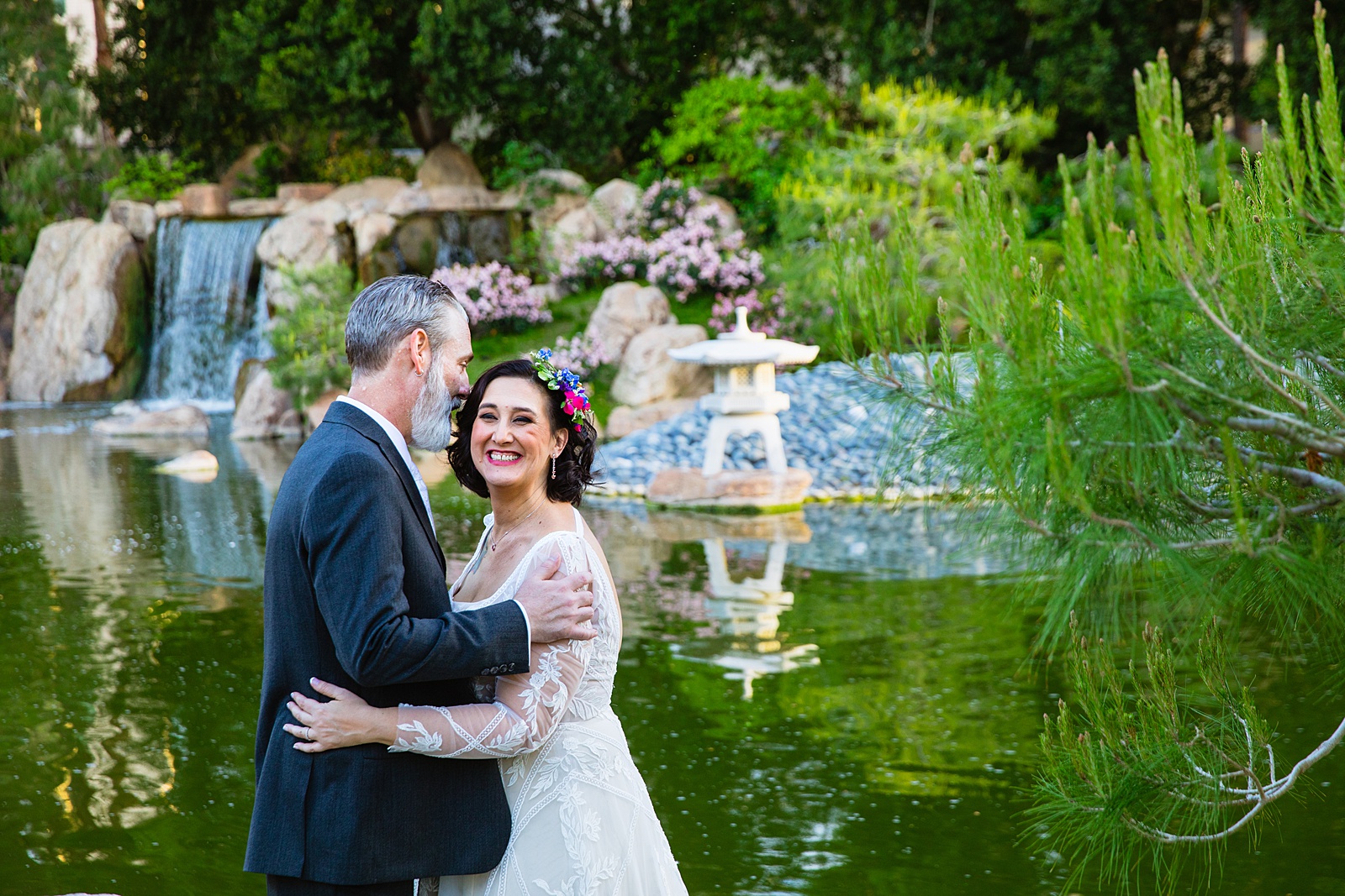 Bride and groom pose for their Japanese Friendship Garden wedding by Phoenix wedding photographer PMA Photography.