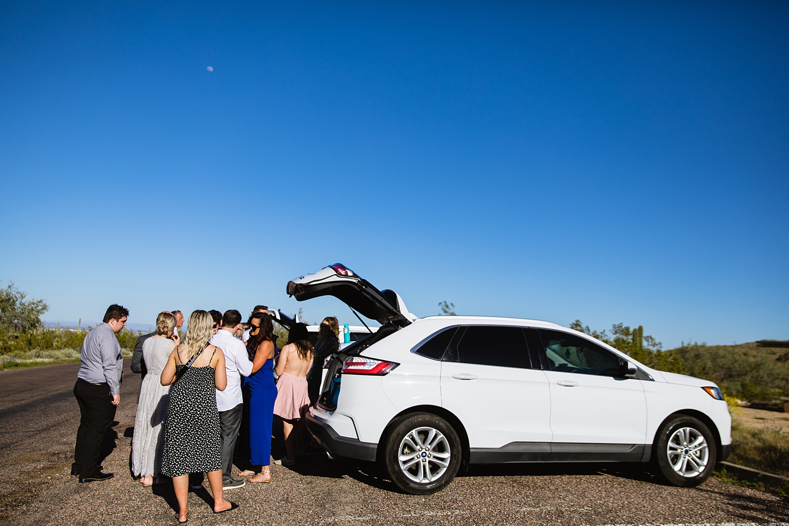 Guests arriving at wedding ceremony at White Tanks by Arizona elopement photographer PMA Photography.