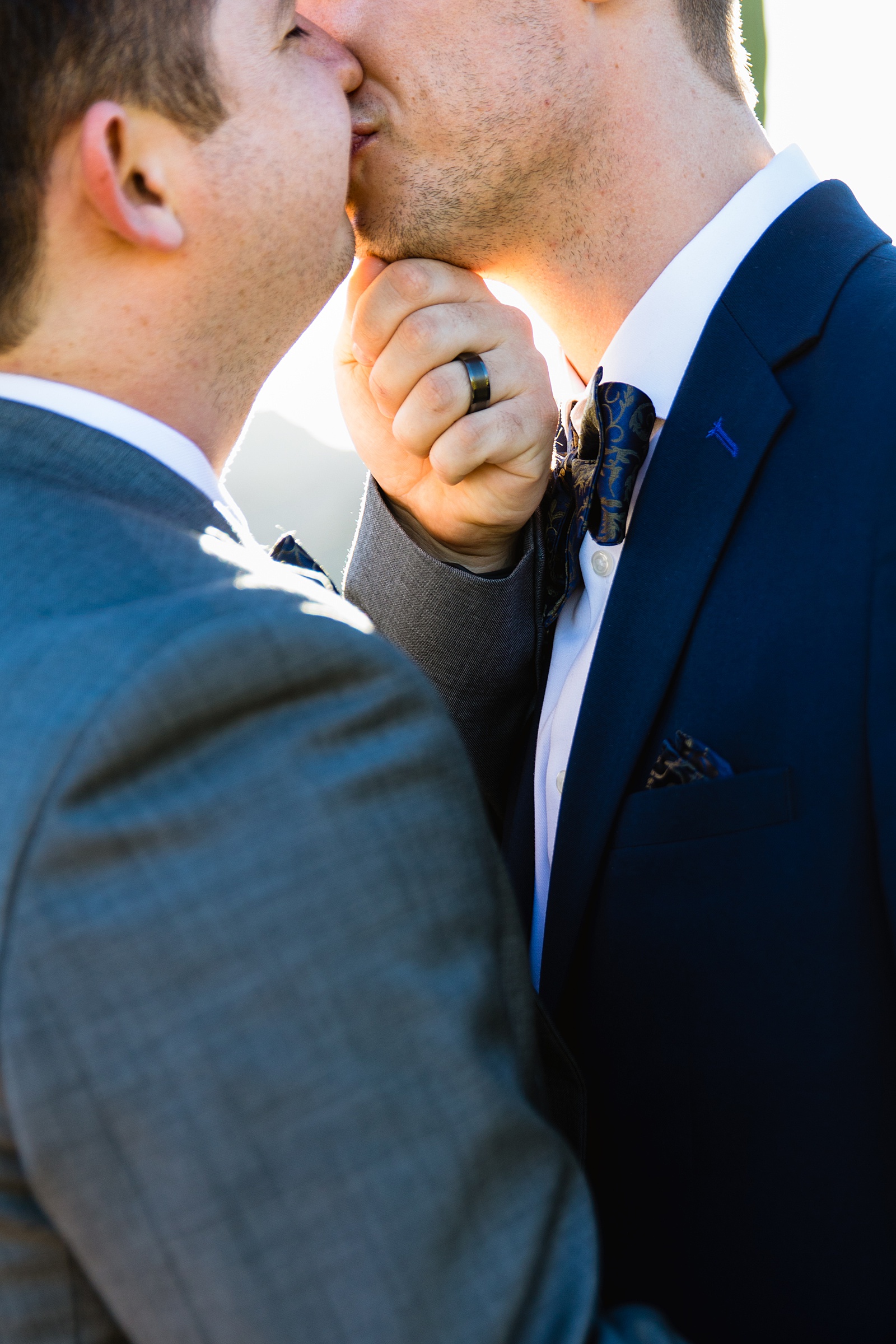 Wedding ring detail during Same sex couple's wedding ceremony at White Tanks by Arizona elopement photographer PMA Photography.