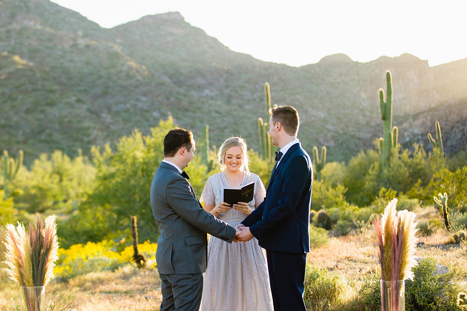 LGBTQ couple togethering during White Tanks wedding ceremony by Phoenix elopement photographer PMA Photography.
