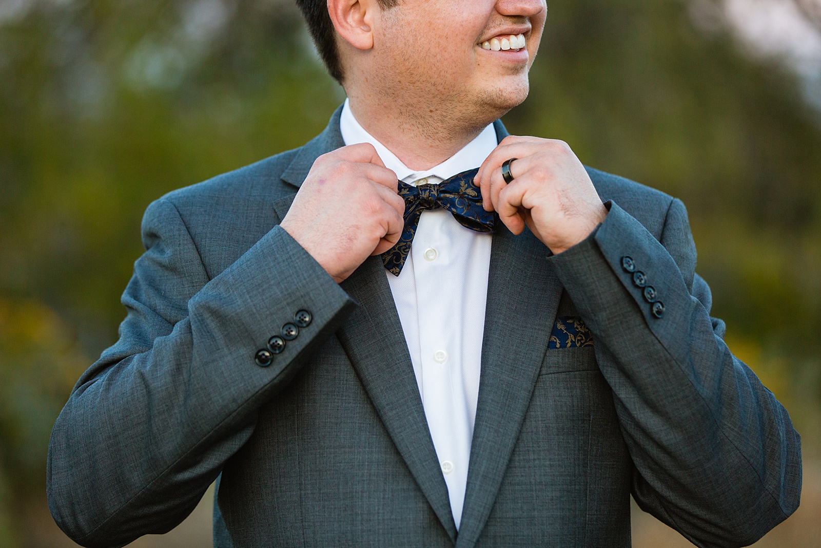 Groom getting ready for his elopement by Arizona elopement photographers PMA Photography.