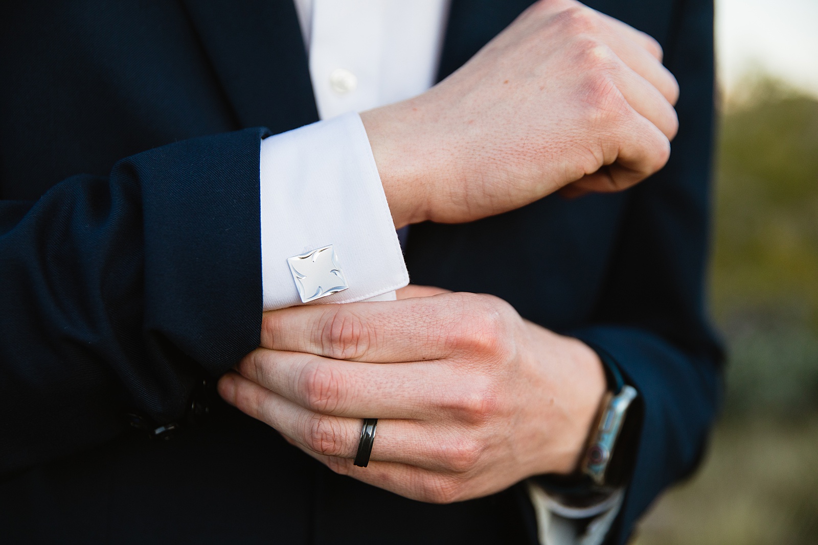 Groom's wedding day details of cufflinks and ring by PMA Photography.