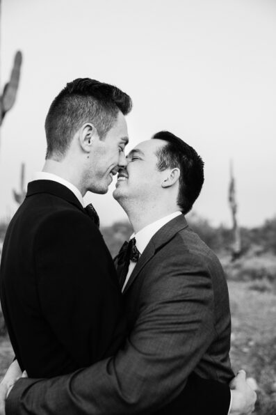 LGBTQ couple share an intimate moment during their White Tanks elopement by Phoenix elopement photographer PMA Photography.