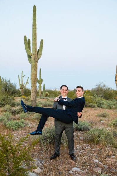 LGBTQ couple laughing together during their White Tanks elopement by Phoenix elopement photographer PMA Photography.