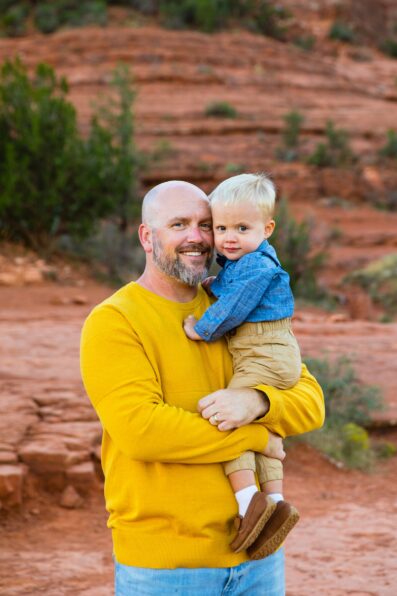Father and son during their Cathedral Rock family session by Sedona family photographer PMA Photography.