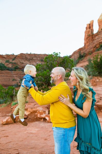 Parents and child during their Cathedral Rock family session by Sedona family photographer PMA Photography.