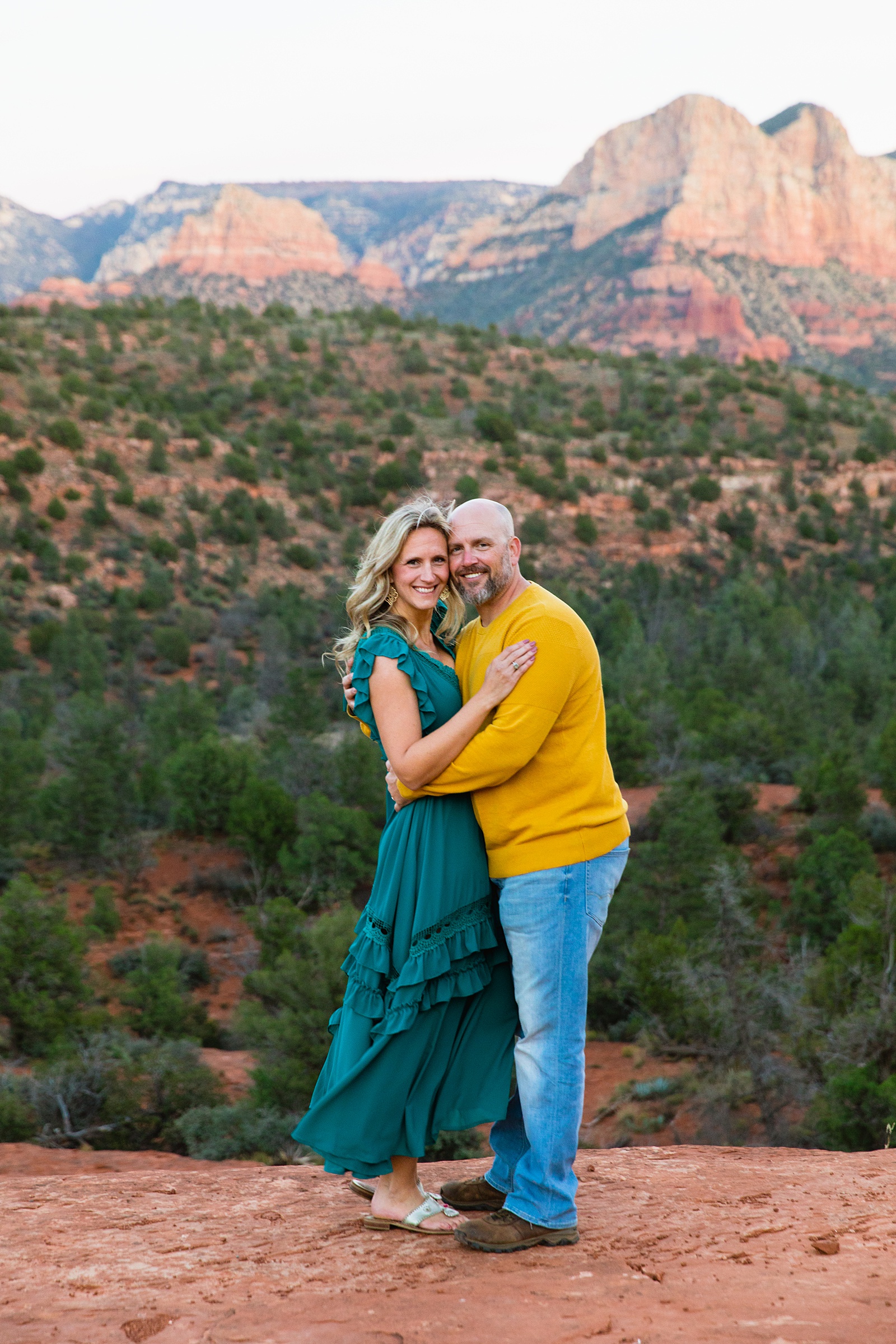 Parents pose together during their Cathedral Rock family session by Sedona family photographer PMA Photography.