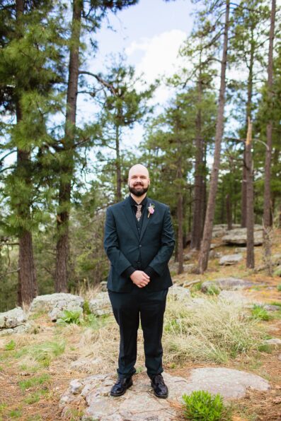 Groom's black suit for his Mogollon Rim elopement by PMA Photography.