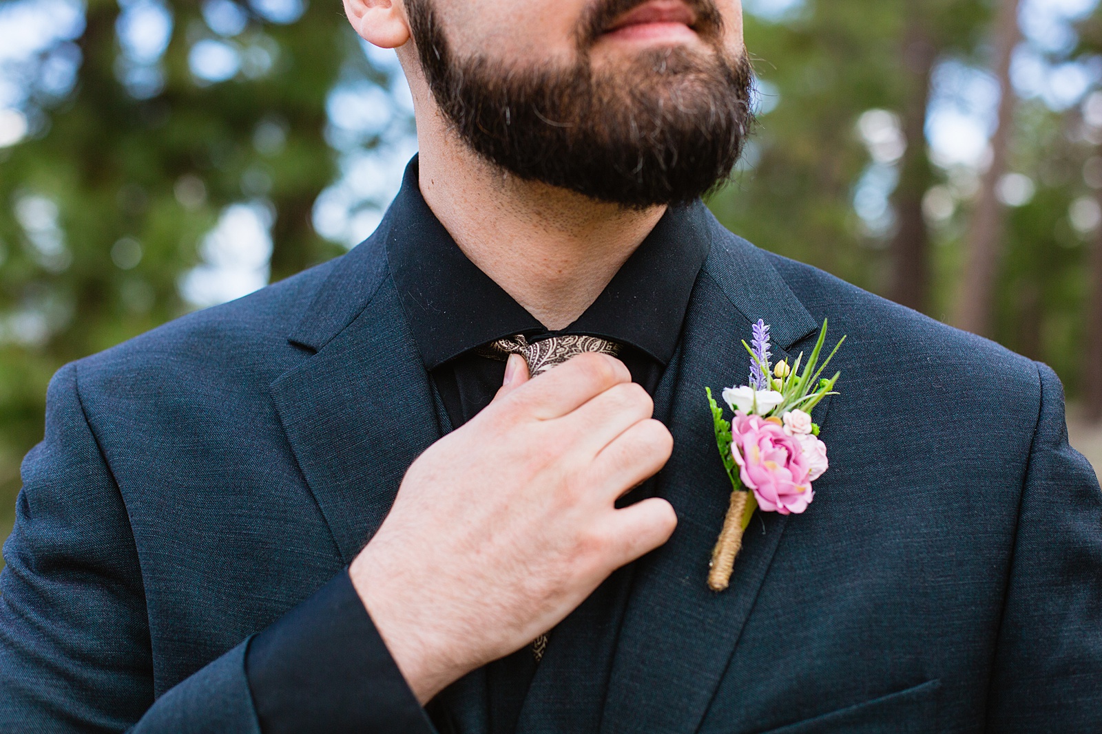 Groom's wedding day details of boutonniere by PMA Photography.