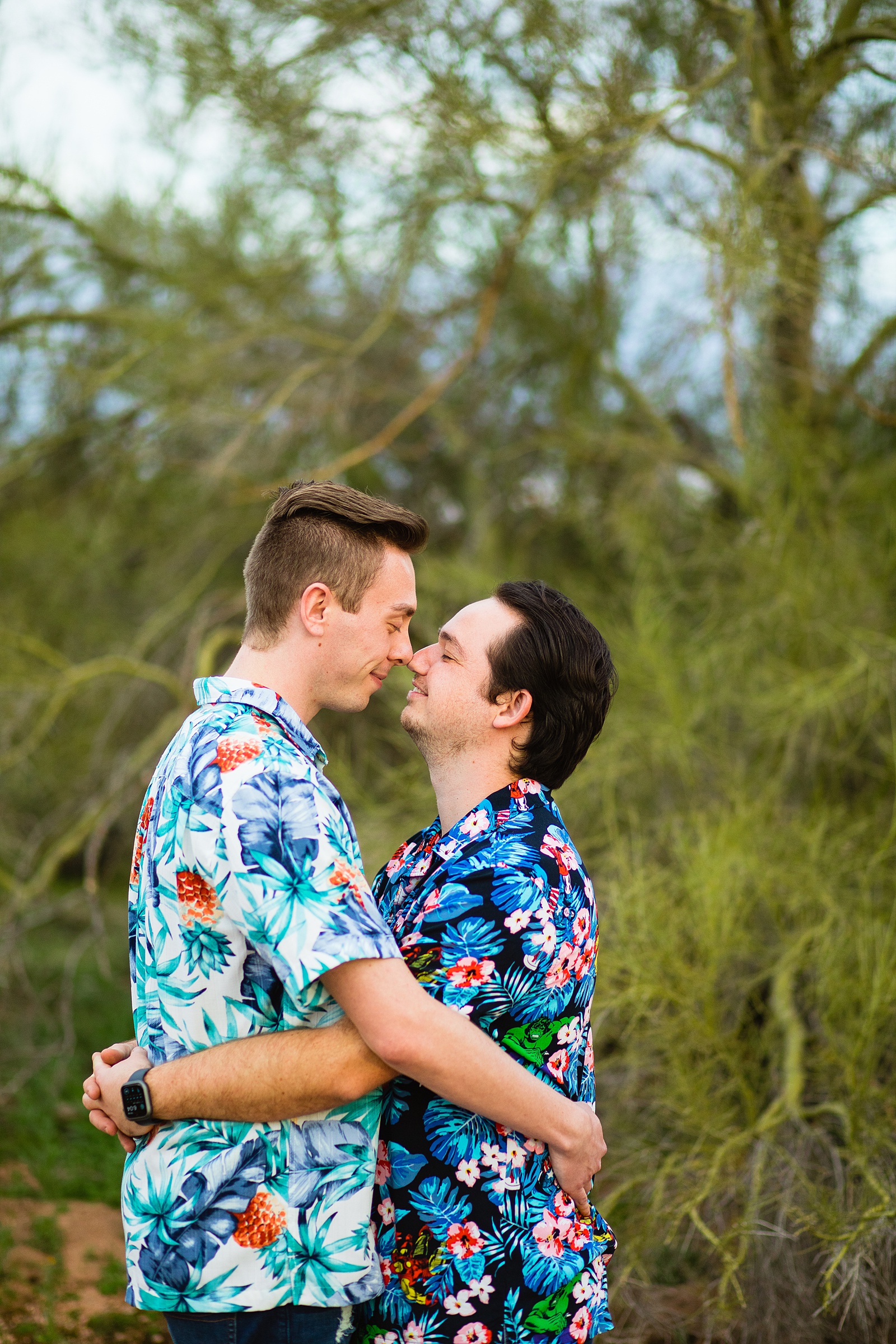 LGBTQ couple share an intimate moment during their Papago Park engagement session by Tempe engagement photographer Juniper and Co Photography.