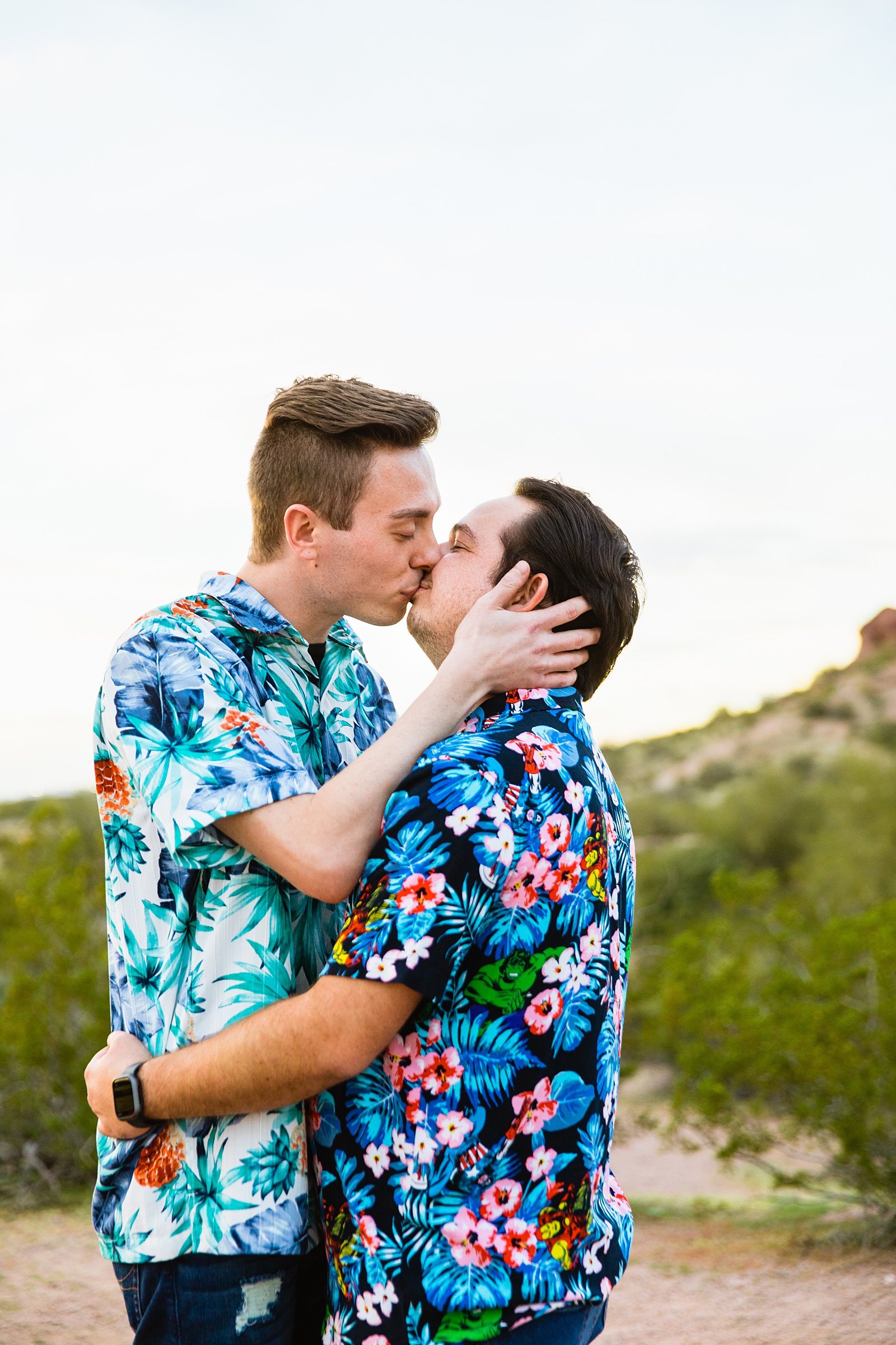 LGBTQ couple share a kiss during their Tempe engagement session by Arizona wedding photographer Juniper and Co Photography.