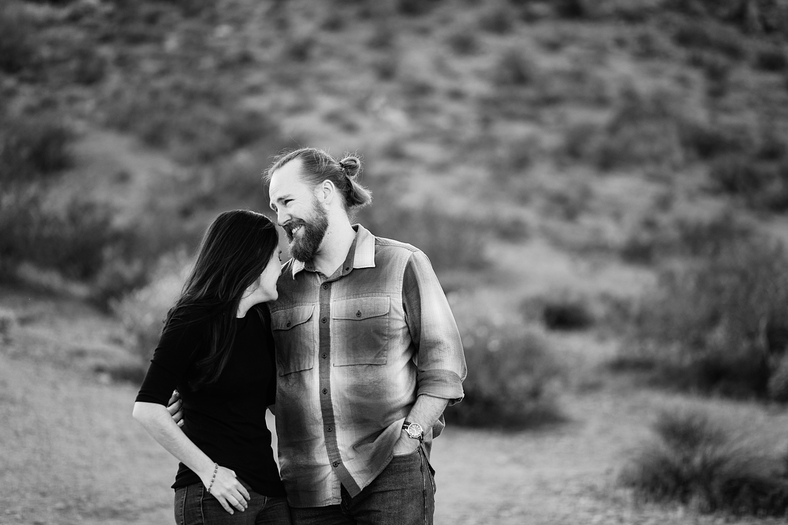 Couple laugh together during their Papago Park engagement session by Tempe engagement photographer Juniper and Co Photography.