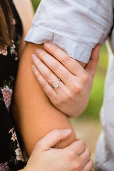 Detail image of couple's engagement session outfits by Juniper and Co Photography.