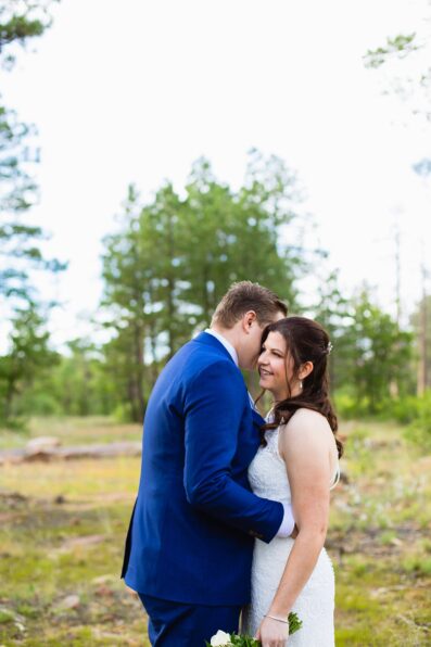 Bride & Groom share an intimate moment during their first look at Mogollon Rim by Arizona elopement photographer Juniper and Co Photography.