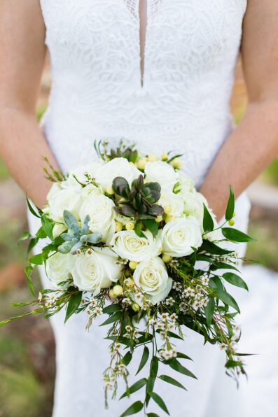 Bride's white rose and succulent bouquet by Juniper and Co Photography.