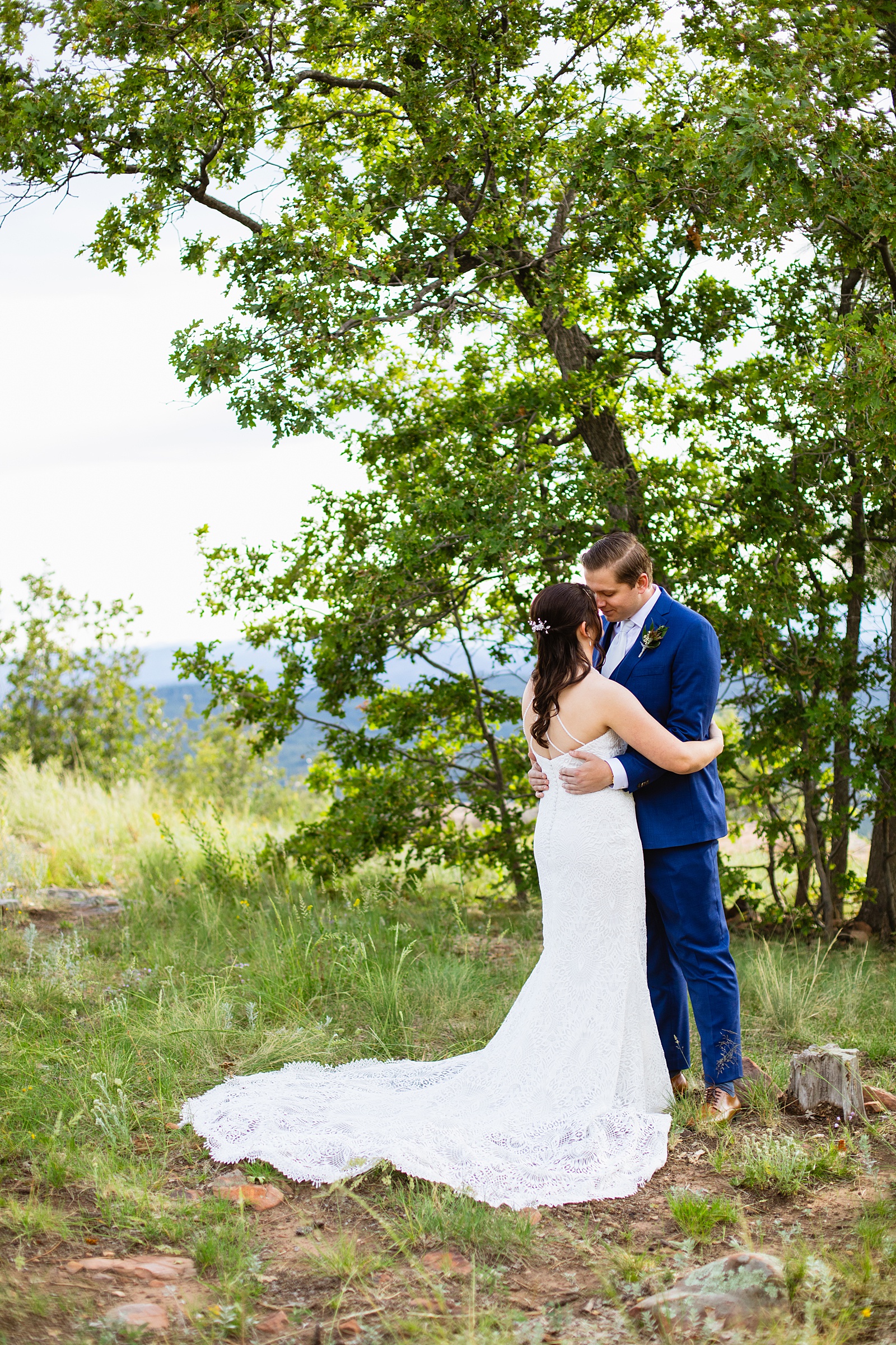Bride & Groom share an intimate moment during their first look at Mogollon Rim by Arizona elopement photographer Juniper and Co Photography.