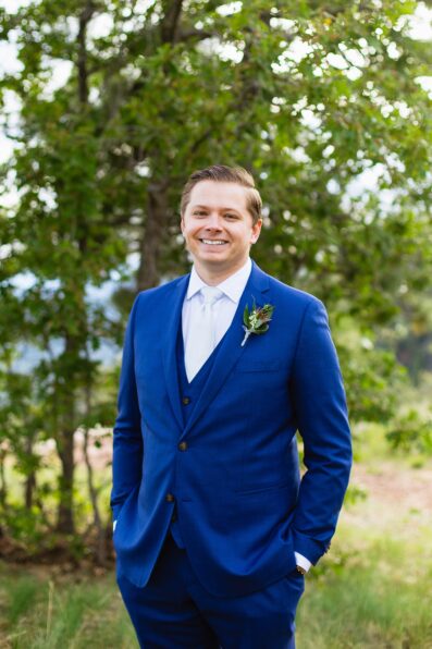 Groom's dark blue suit for his Mogollon Rim elopement by Juniper and Co Photography.