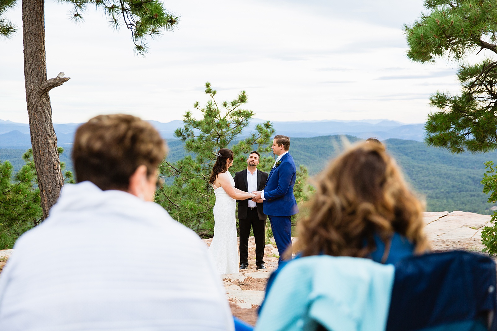 Bride & Groom exchange vows during their wedding ceremony at Mogollon Rim by Arizona elopement photographer Juniper and Co Photography.