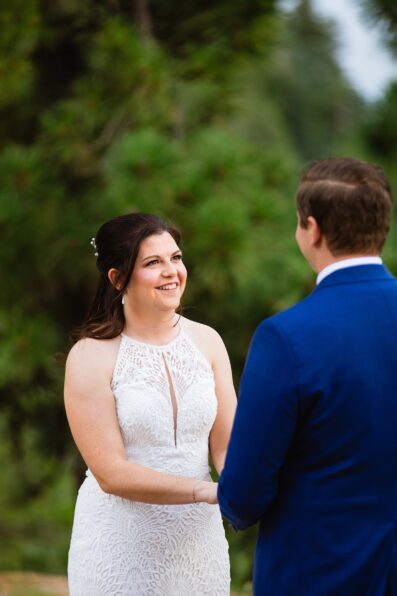 Bride looking at her groom during their wedding ceremony at Mogollon Rim by Payson elopement photographer Juniper and Co Photography.
