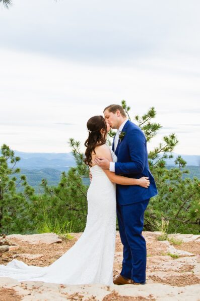 Bride & Groom share their first kiss during their wedding ceremony at Mogollon Rim by Arizona elopement photographer Juniper and Co Photography.