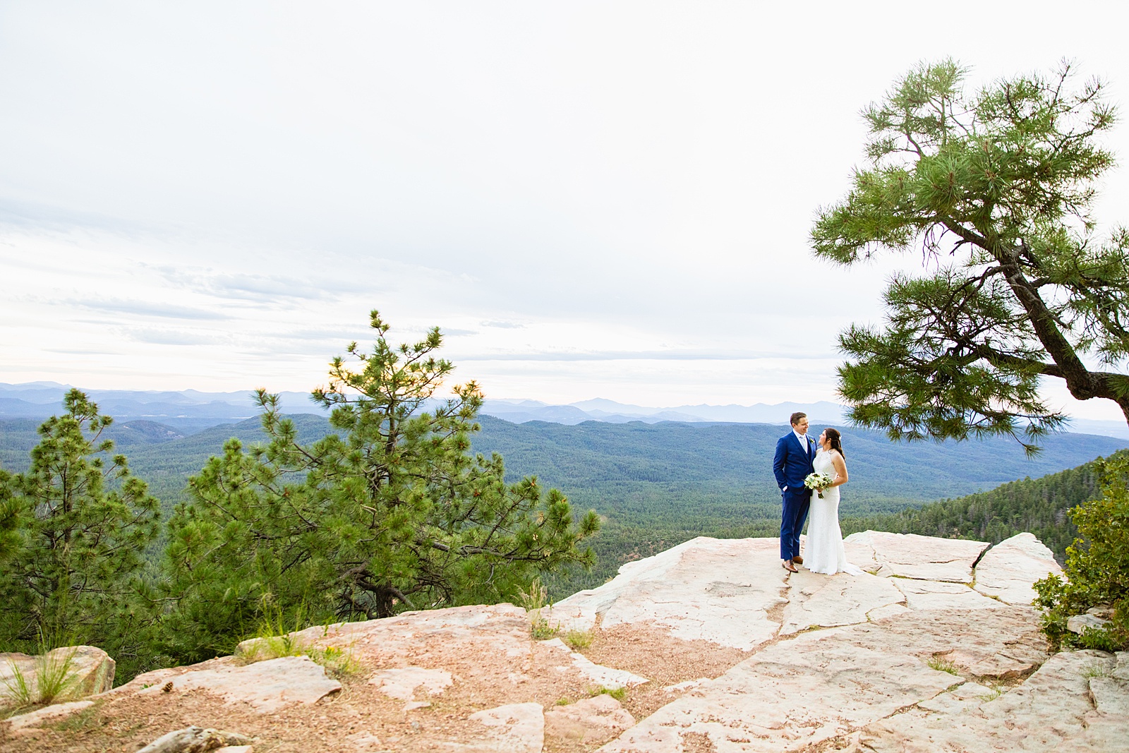 Bride & Groom togethering at their Mogollon Rim wedding ceremony by Payson elopement photographer Juniper and Co Photography.