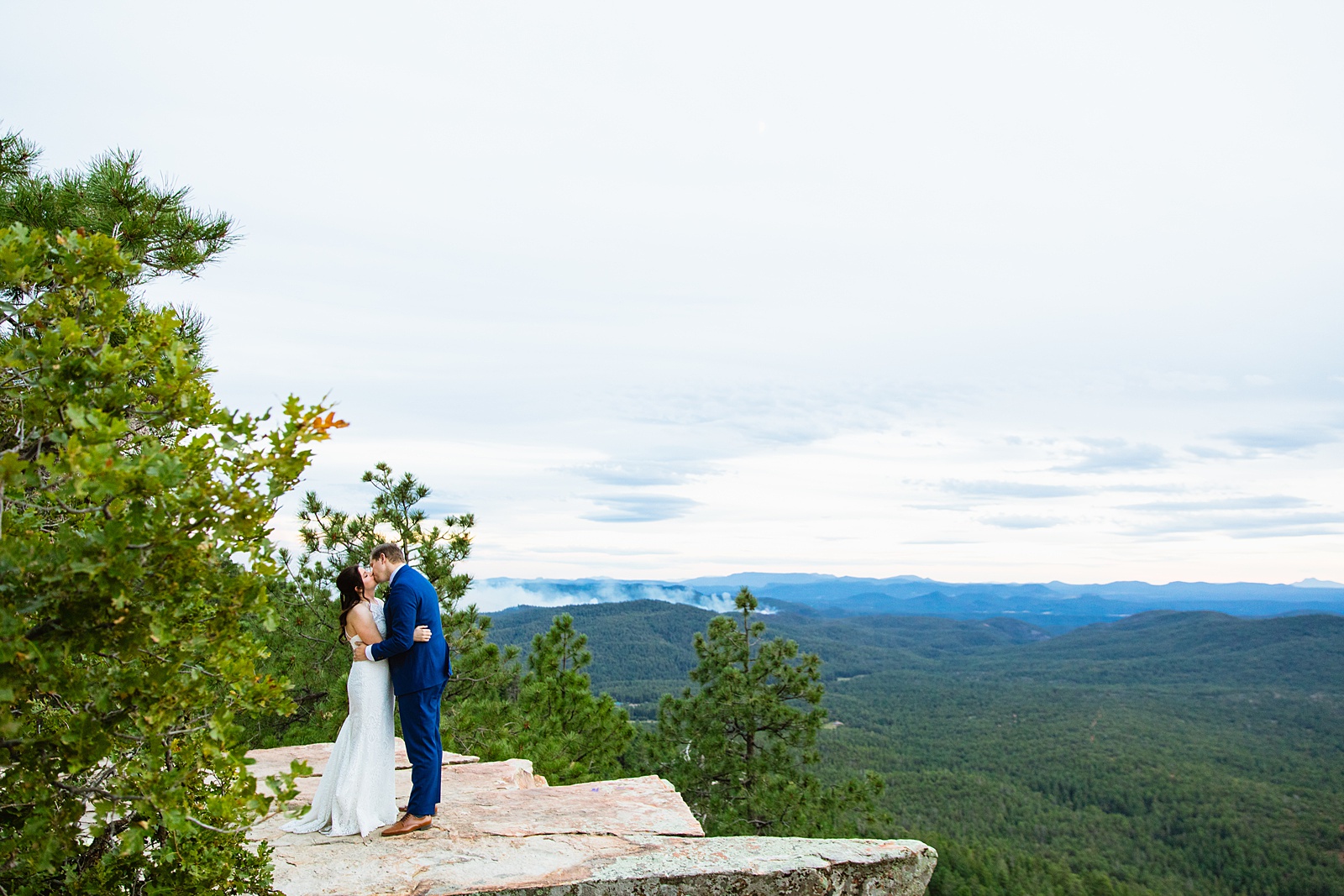 Bride & Groom share a kiss during their Mogollon Rim elopement by Payson elopement photographer Juniper and Co Photography.