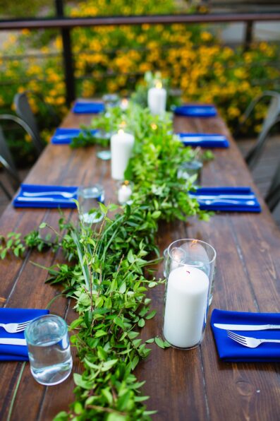Dark blue table settings at San Tan Gardens wedding reception by Phoenix wedding photographer Juniper and Co Photography.
