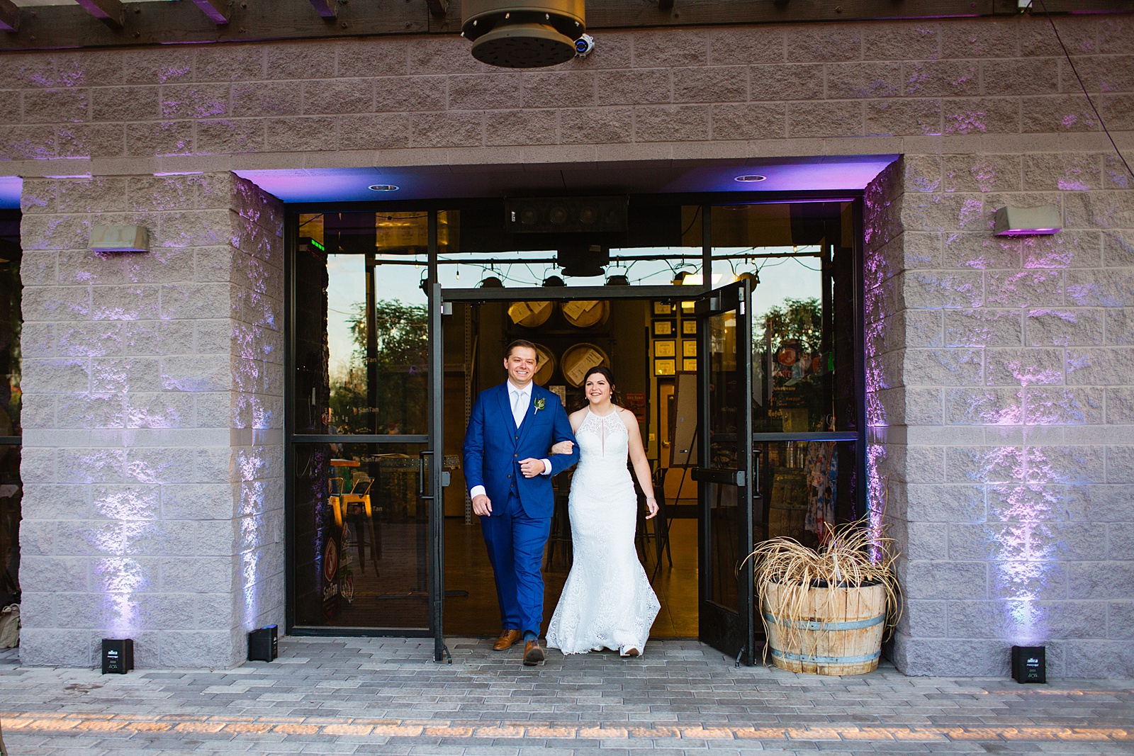 Couple's grand entrance at San Tan Gardens wedding reception by San Tan wedding photographer Juniper and Co Photography.