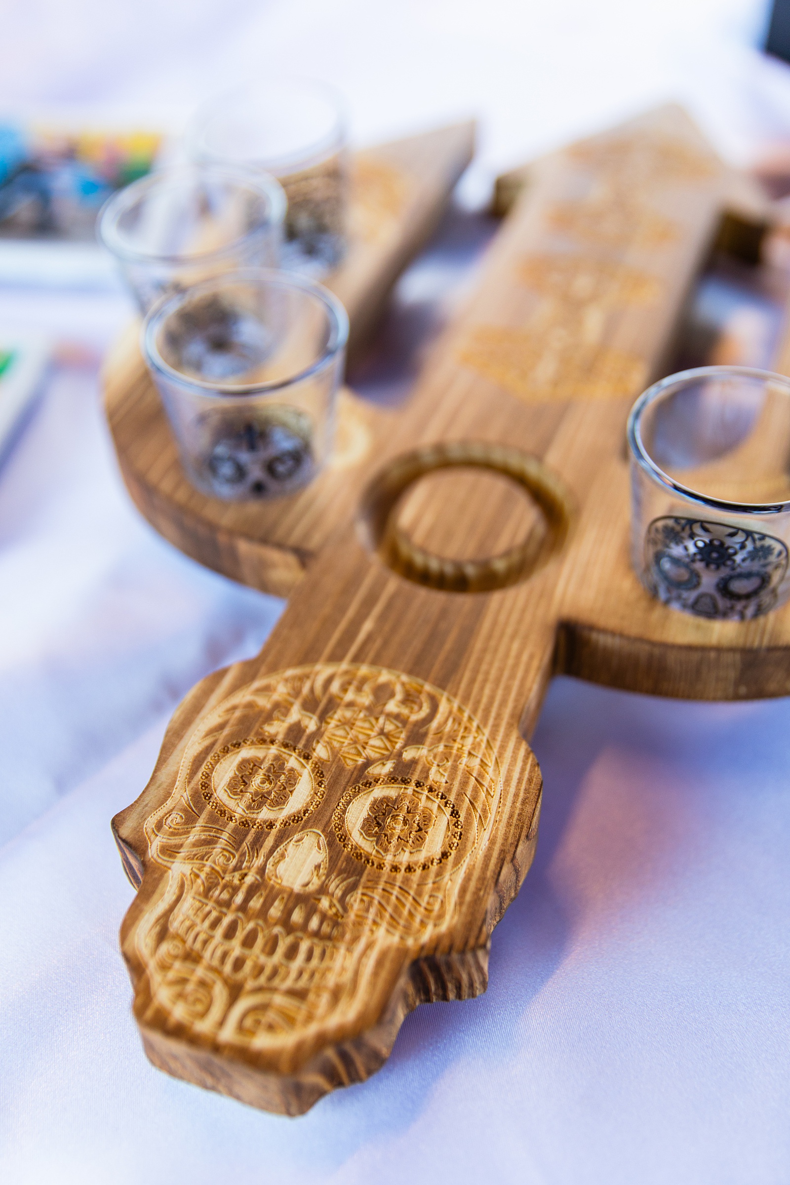 Couple's wedding day details of shot glasses and coasters by Juniper and Co Photography.