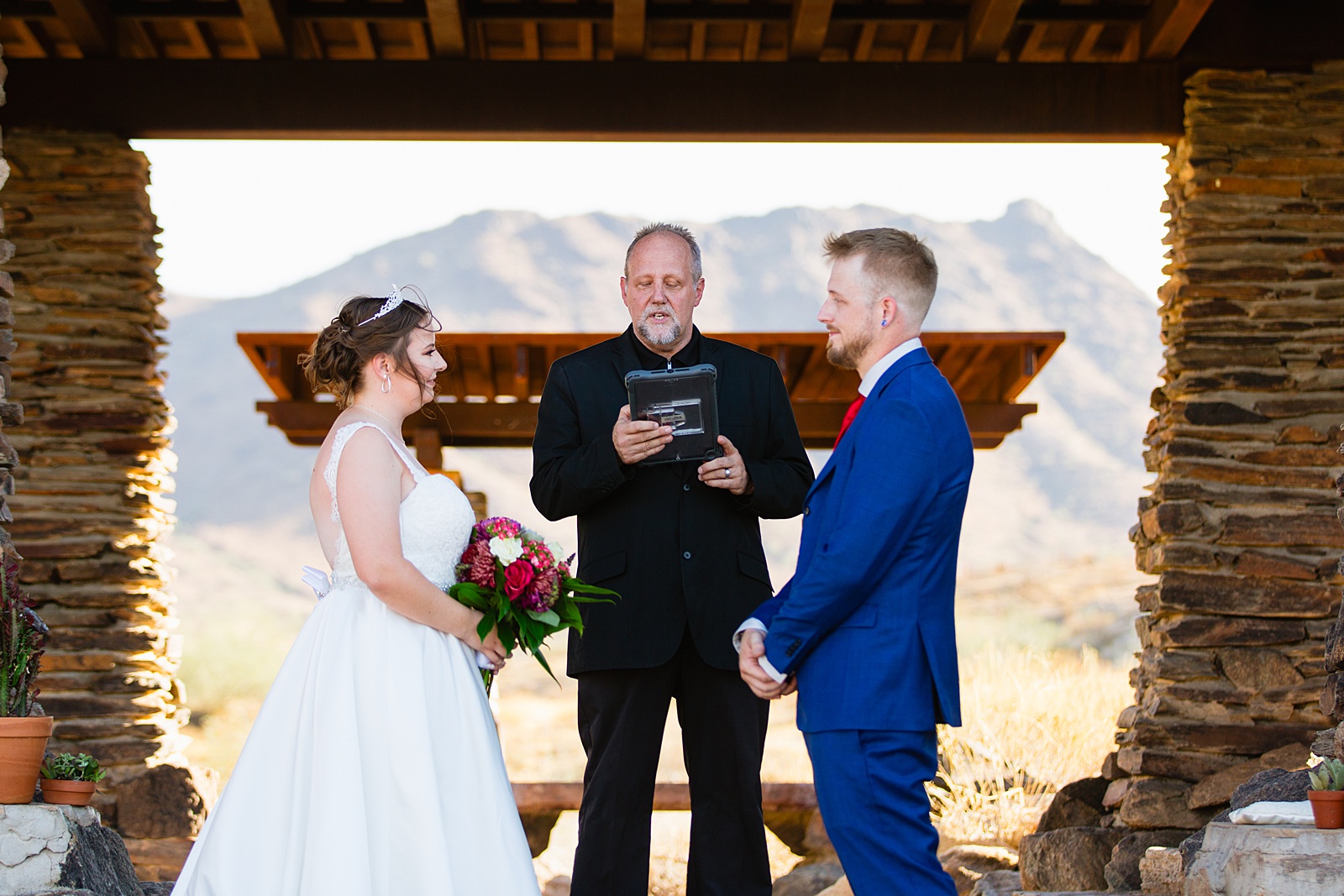 Wedding ceremony at intimate desert by Phoenix wedding photographer Juniper and Co Photography.