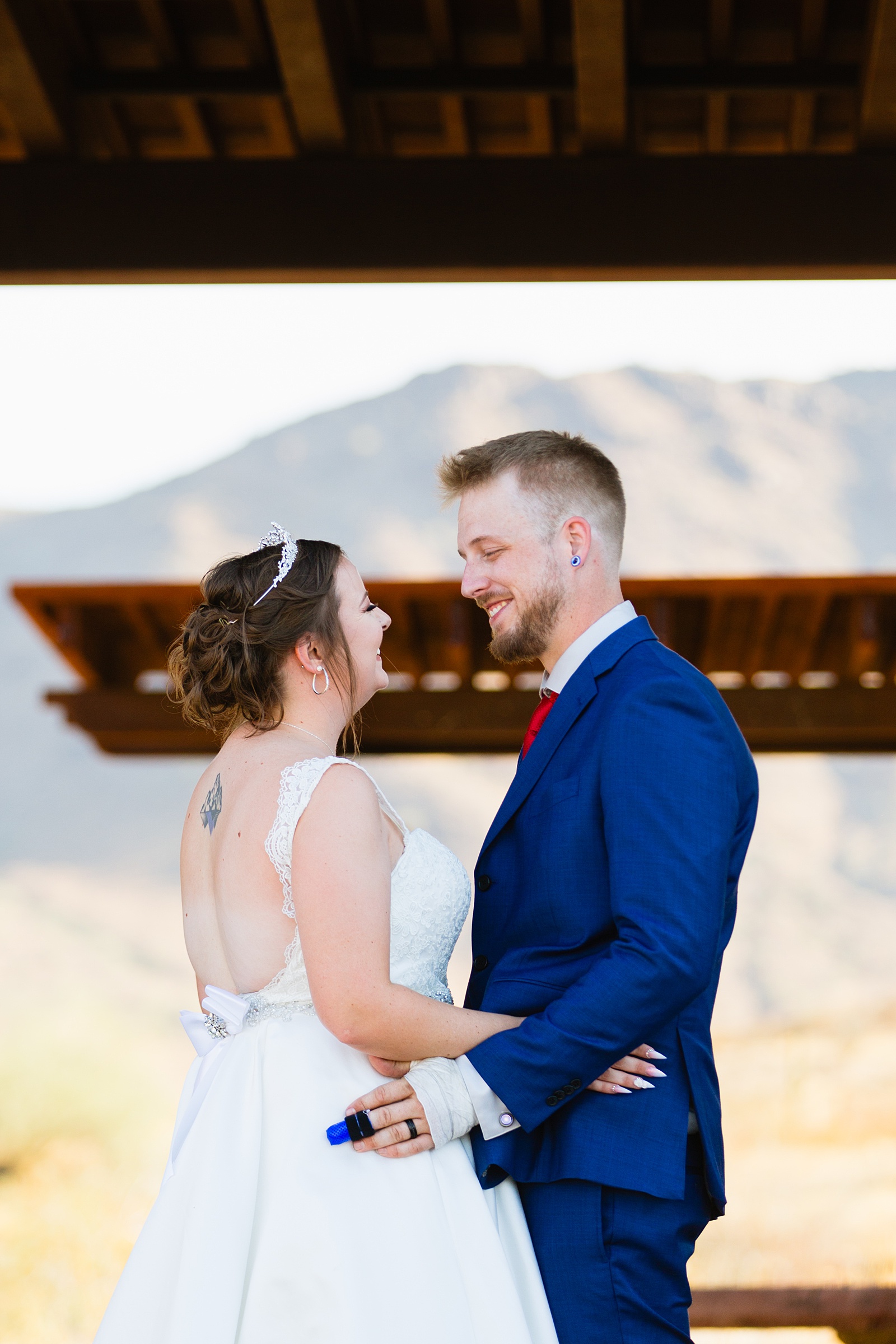 Bride and groom together during intimate desert wedding ceremony by Phoenix wedding photographer Juniper and Co Photography.