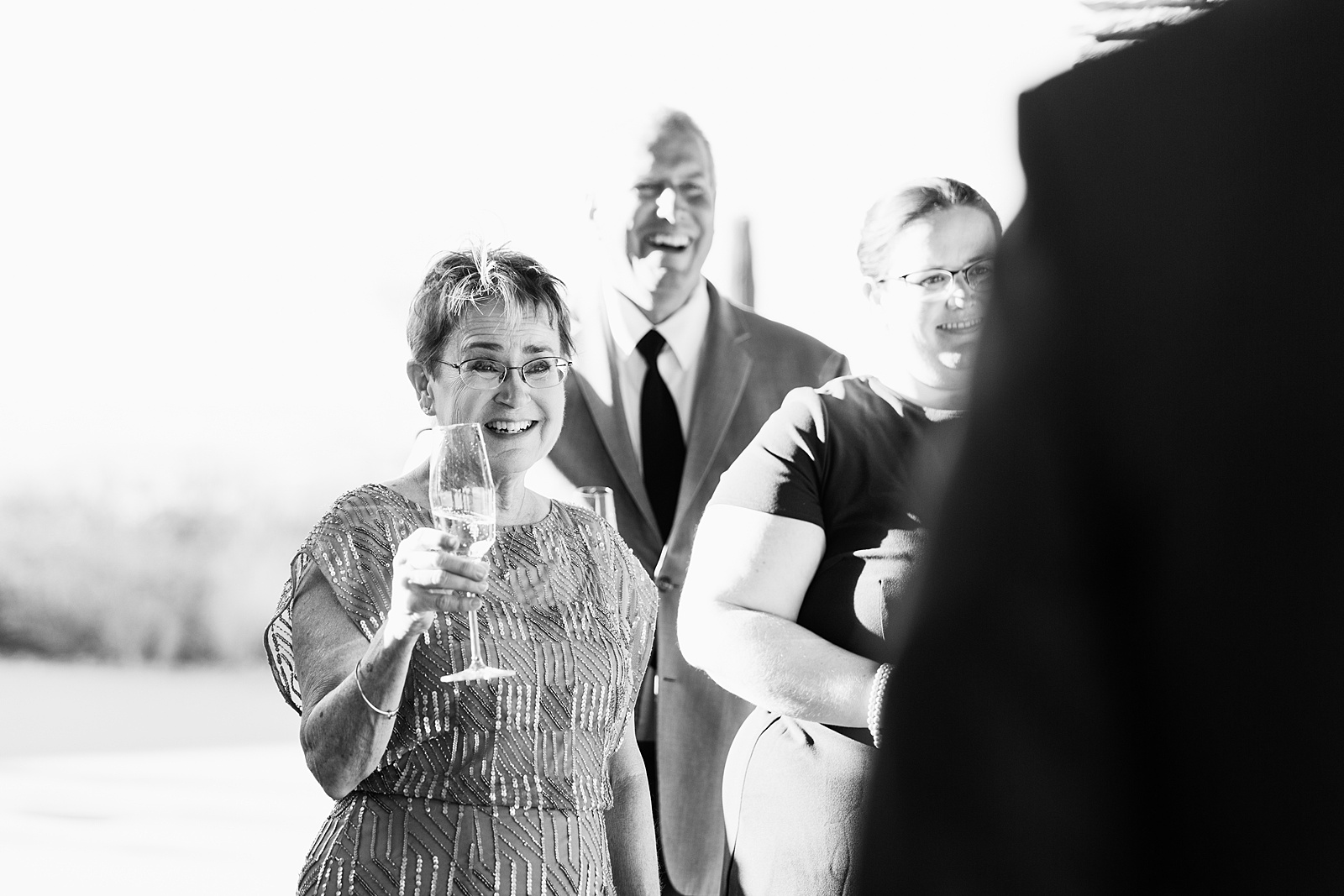 Toasts at intimate desert wedding reception by Phoenix wedding photographer Juniper and Co Photography.