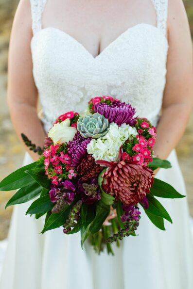 Bride's vibrant bouquet by Juniper and Co Photography.
