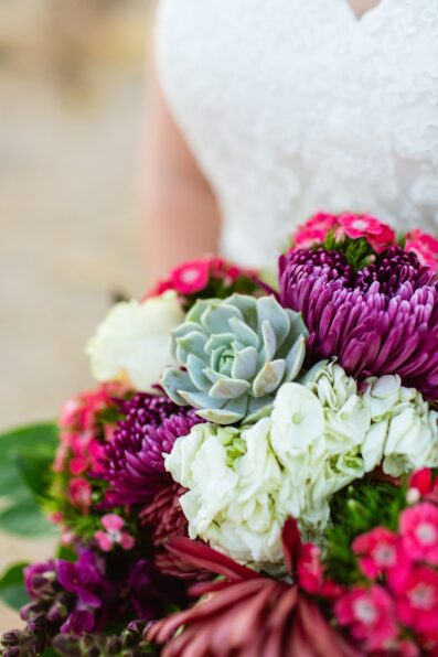 Bride's vibrant bouquet by Juniper and Co Photography.