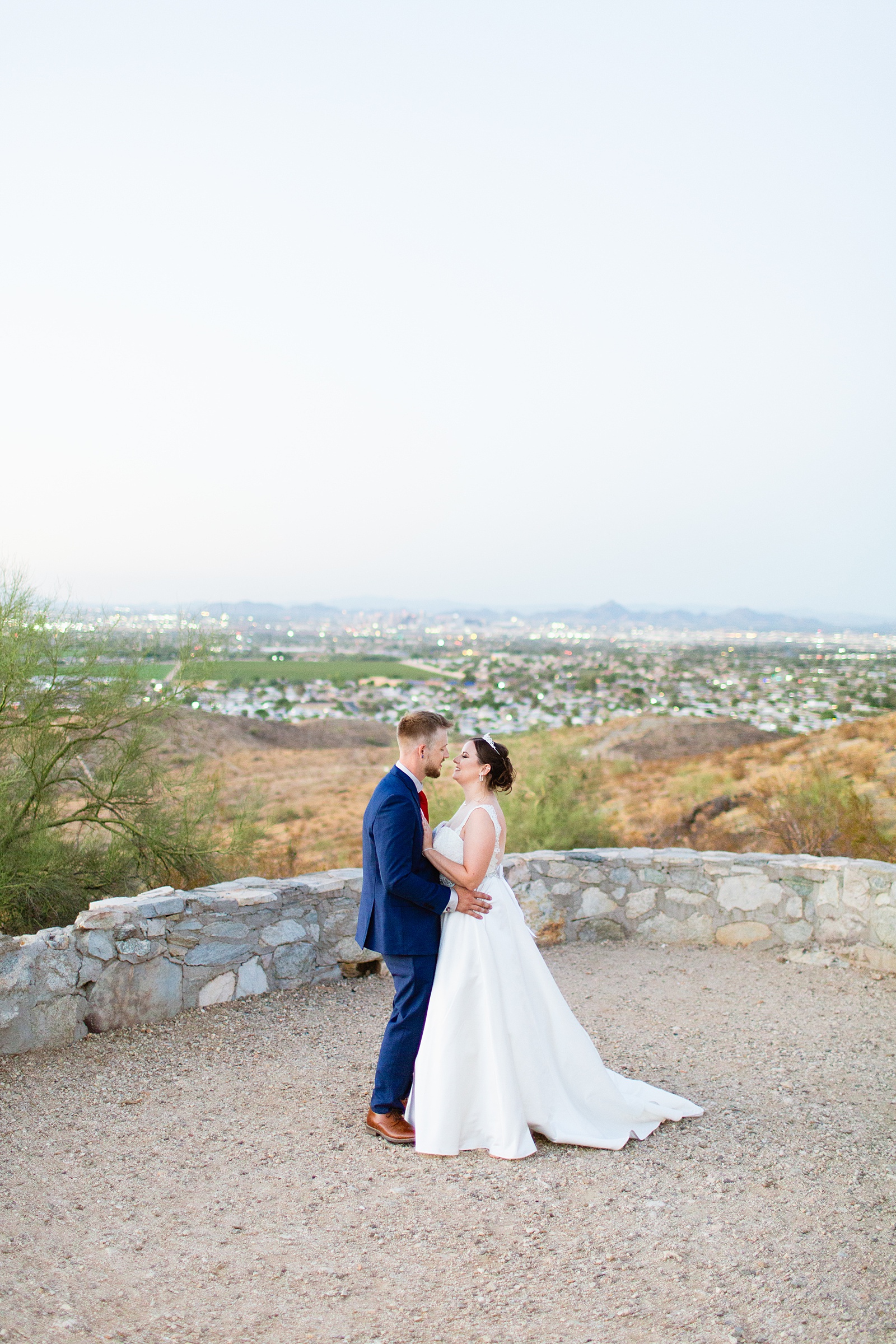 Bride and groom share an intimate moment during their intimate desert wedding by Phoenix wedding photographer Juniper and Co Photography.