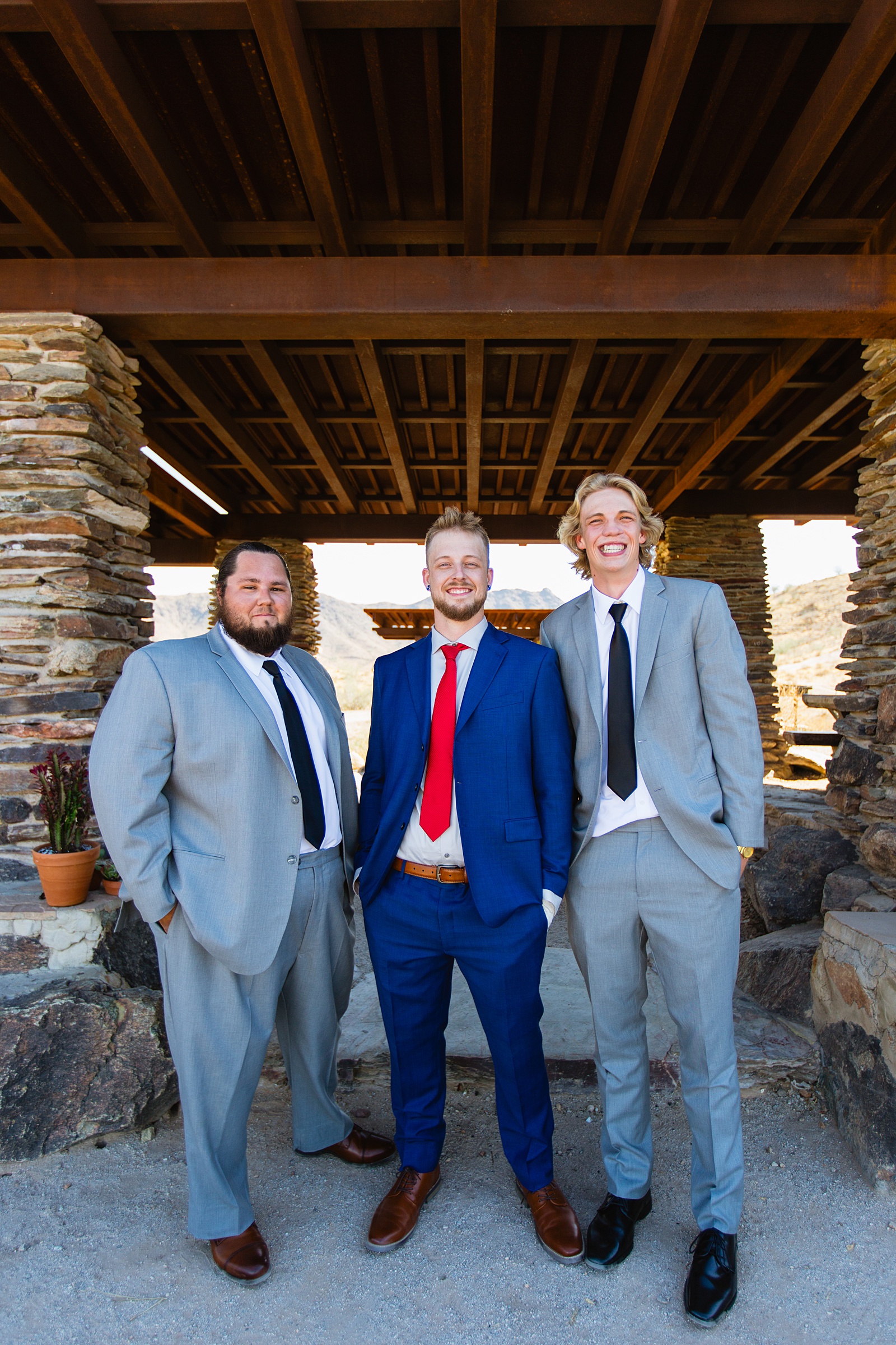 Groom and groomsmen together at a intimate desert wedding by Arizona wedding photographer Juniper and Co Photography.