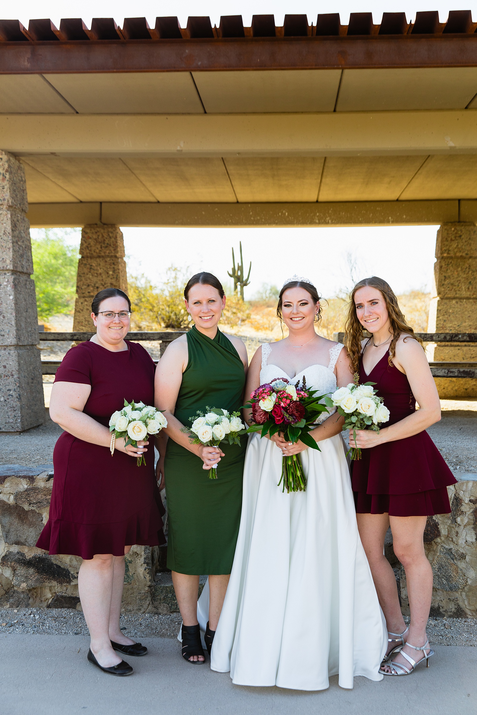 Bride and bridesmaids outfit details by Juniper and Co Photography.