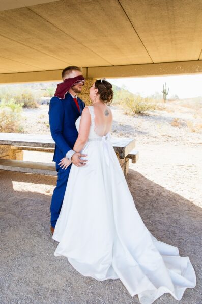 Bride and groom's first look at intimate desert by Phoenix wedding photographer Juniper and Co Photography.