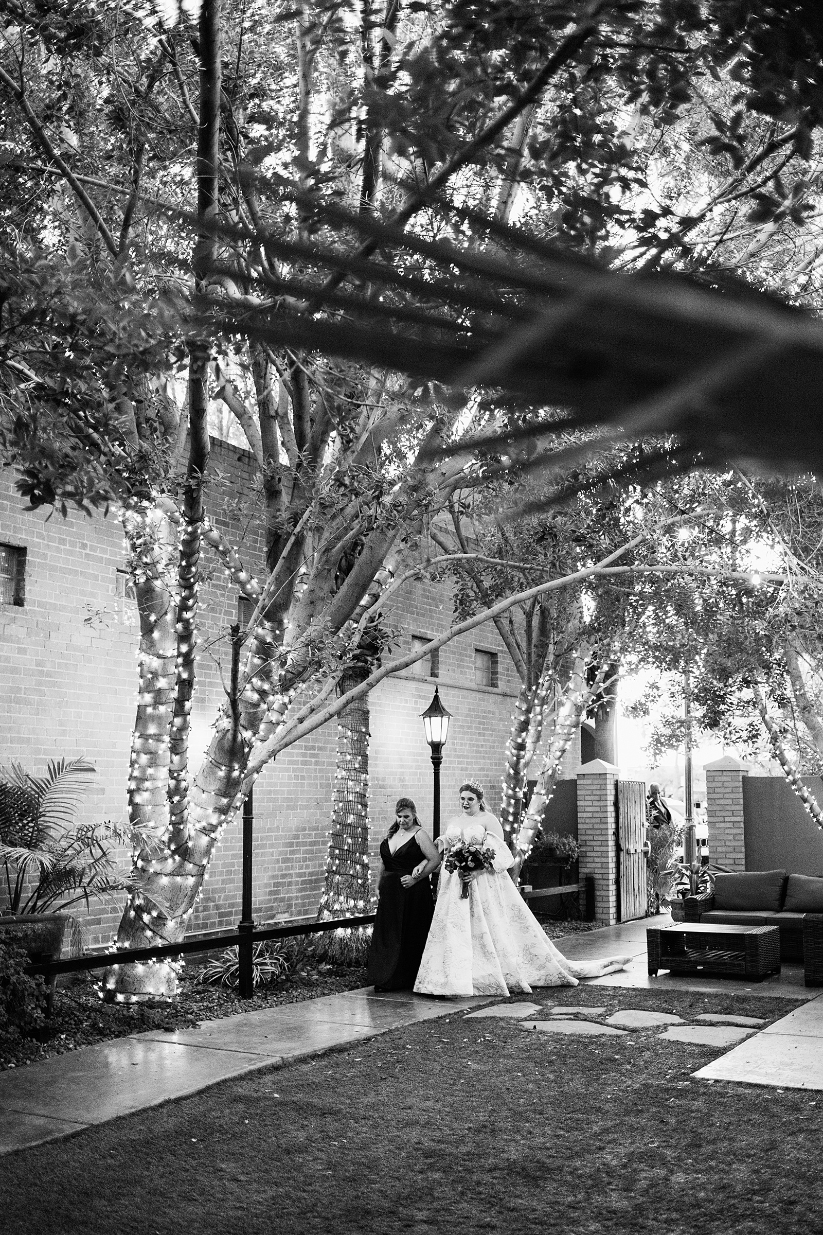 Bride walking down aisle during Regency Garden wedding ceremony by Phoenix wedding photographer Juniper and Co Photography.