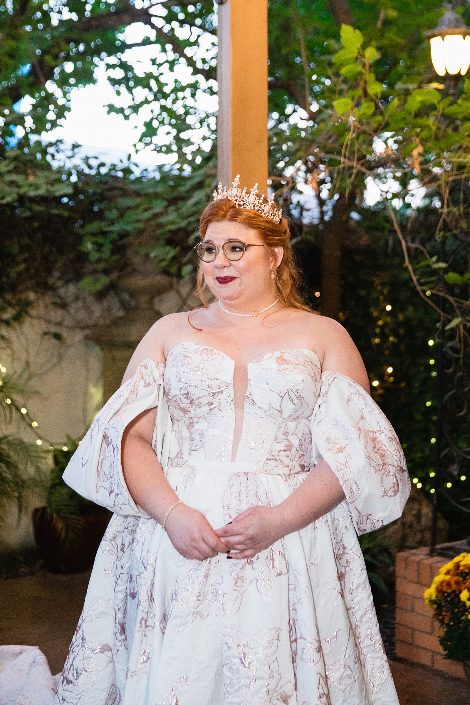 Bride looking at her bride during their wedding ceremony at Regency Garden by Mesa wedding photographer Juniper and Co Photography.