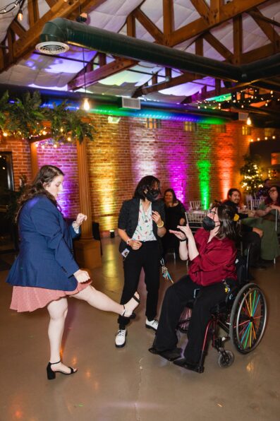 Guests dancing together at Regency Garden wedding reception by Mesa wedding photographer Juniper and Co Photography.