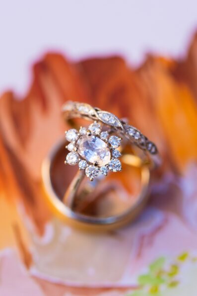 Bride and groom's wedding day details of wedding bands by Juniper and Co Photography.