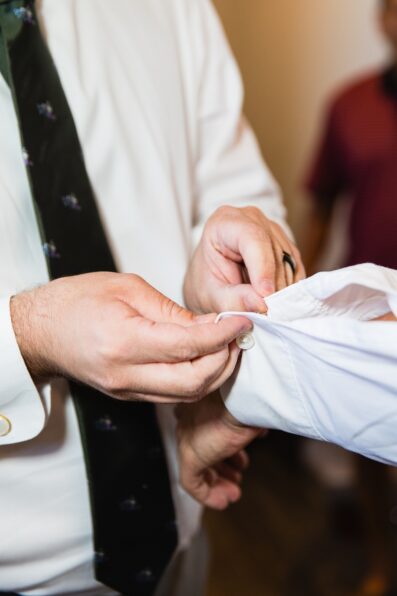 Groom getting ready for his wedding by Phoenix wedding photographers Juniper and Co Photography.