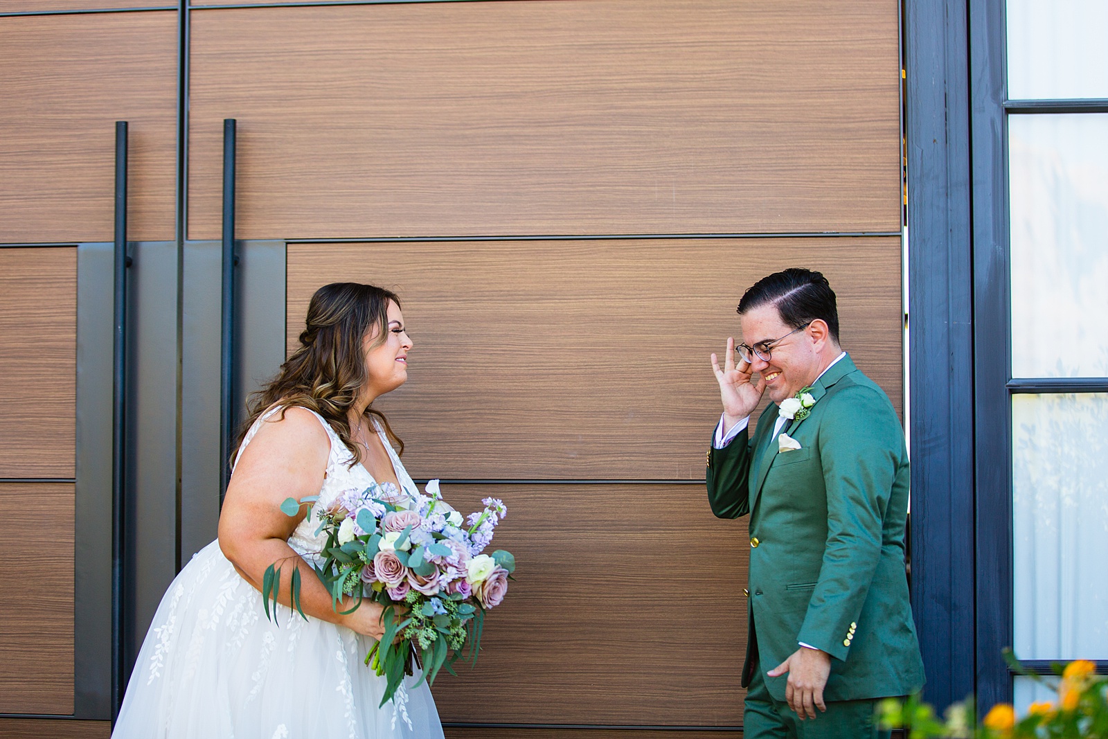 Bride and groom share an intimate moment during their first look at Phoenix desert intimate wedding by Phoenix wedding photographer Juniper and Co Photography.