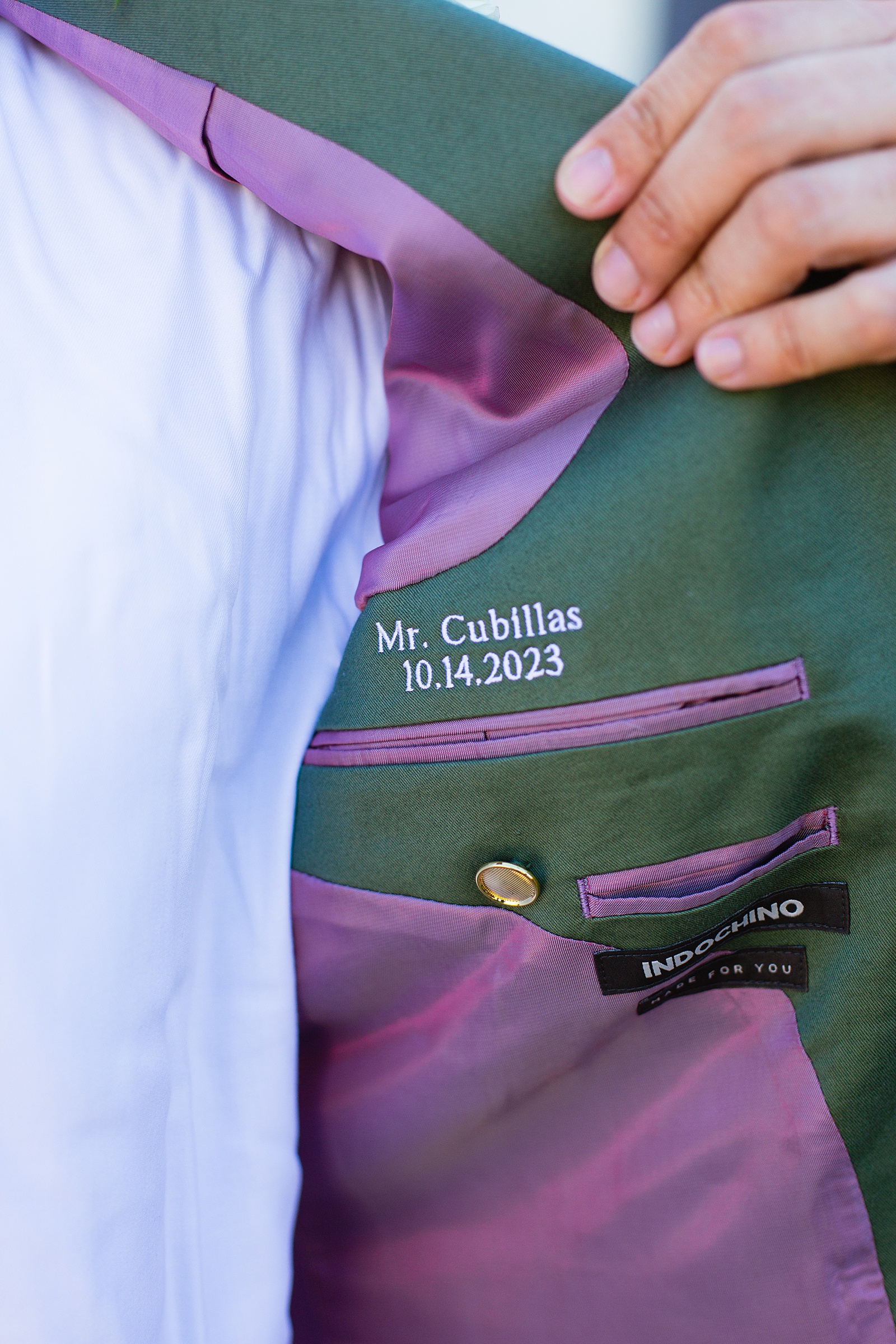 Groom's sage green suit with custom embroidery for his Phoenix desert intimate wedding by Juniper and Co Photography.