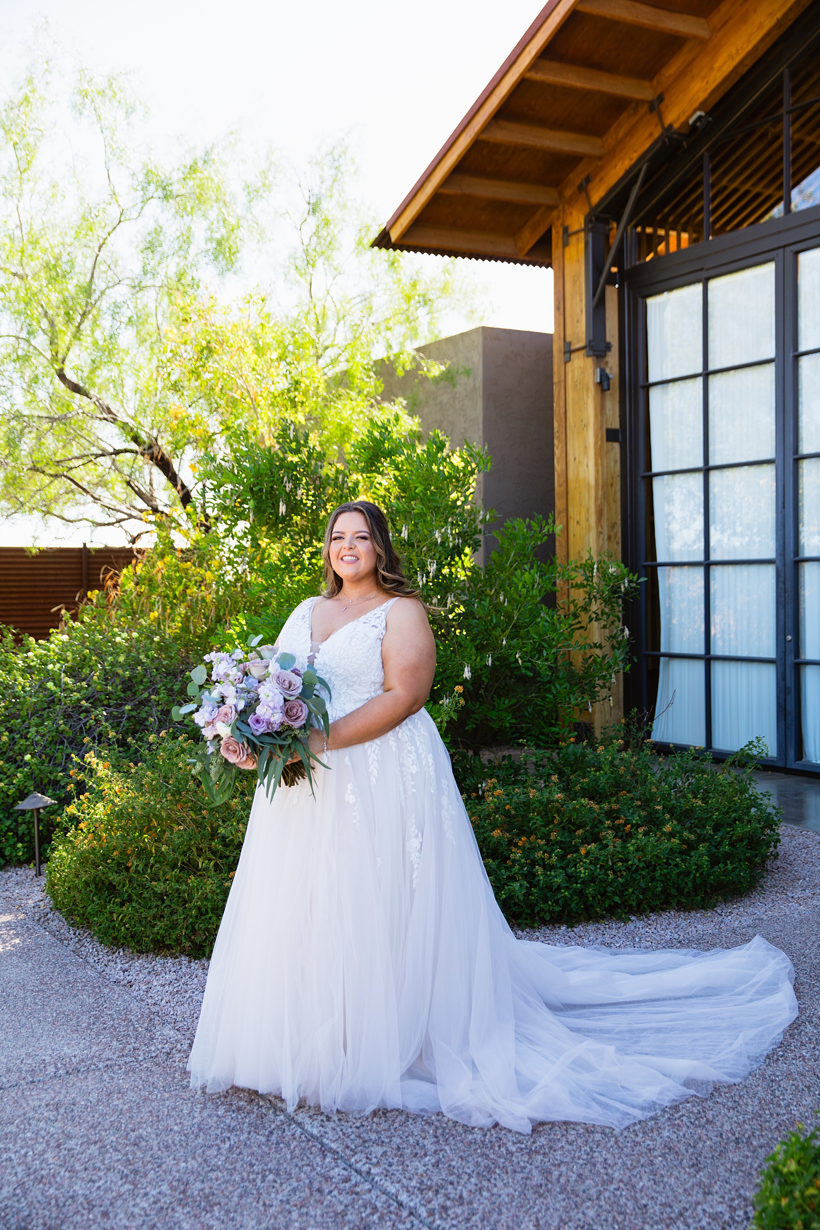 Bride's floral and romantic wedding dress for her Phoenix desert intimate wedding by Juniper and Co Photography.