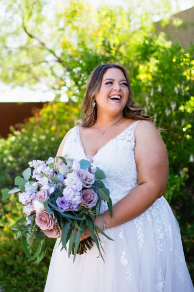 Bride's floral and romantic wedding dress for her Phoenix desert intimate wedding by Juniper and Co Photography.